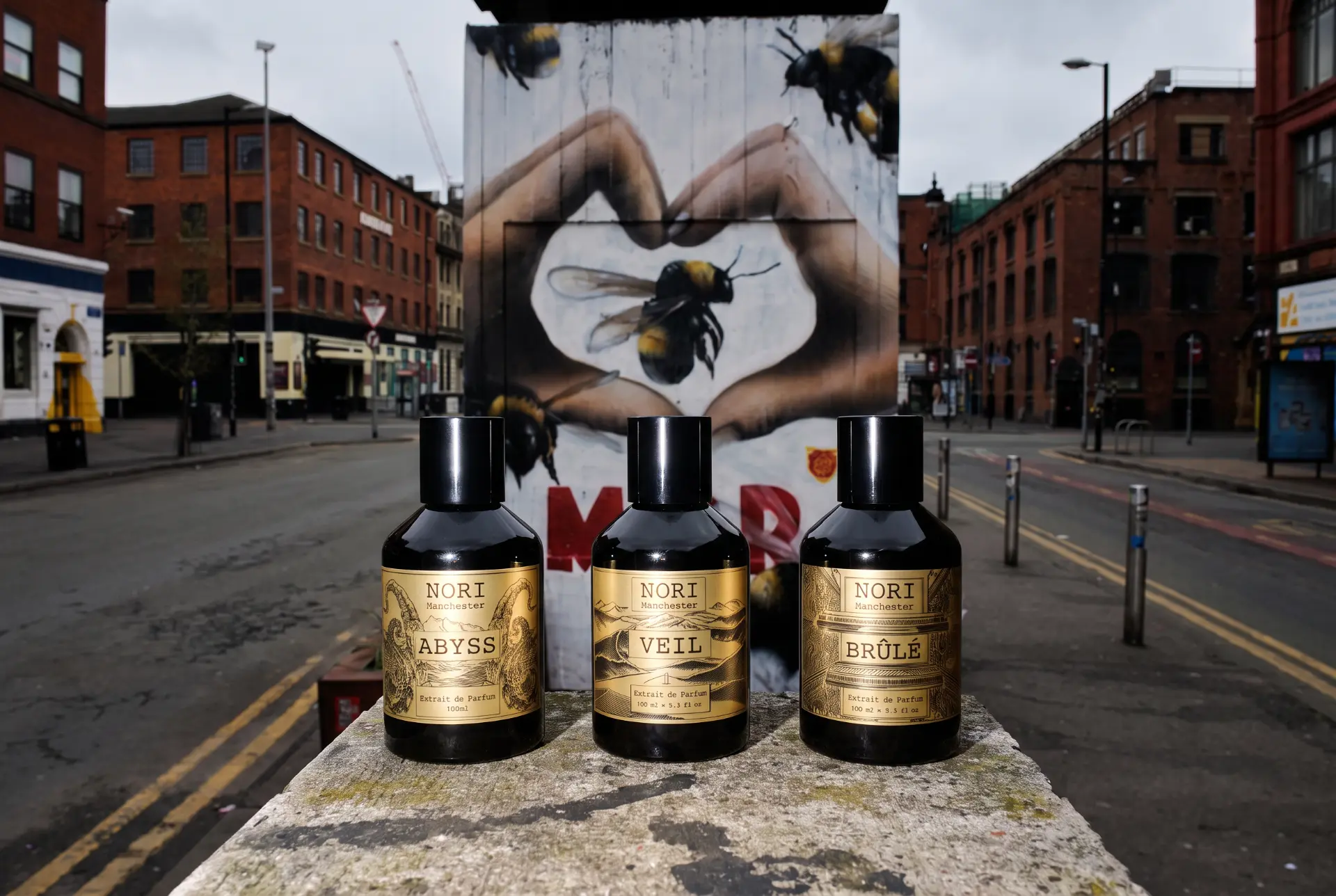 NORI Abyss, Veil and Brûlé in front of the Manchester bee mural